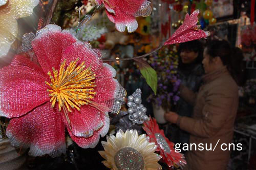 图：玉门市花卉市场 虎年春节前销售火爆